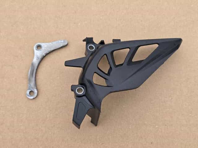 Osłona przedniej zębatki Honda CRF 250 r. 10-17 / CRF 450 r. 09-16 OEM