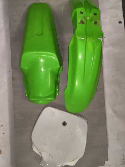 Kawasaki kx 80 85 błotnik plastron skrzynia pompa dekiel karter tryb
