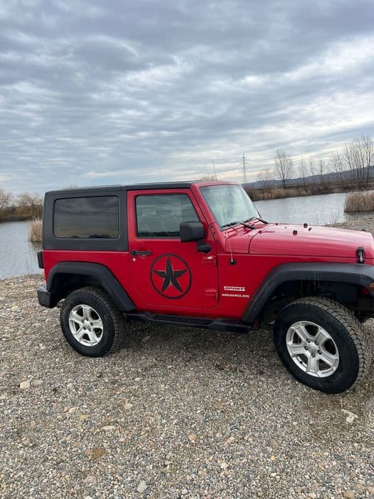 Vând Jeep Wrangler sport .