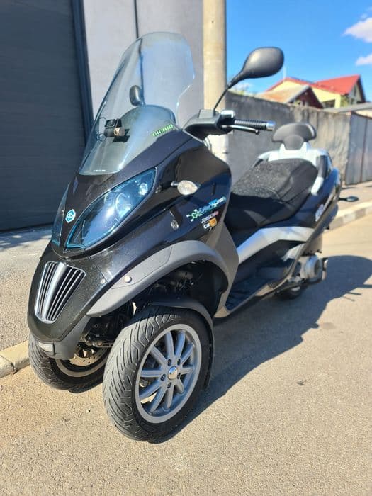Piaggio mp3 250i se conduce cu B