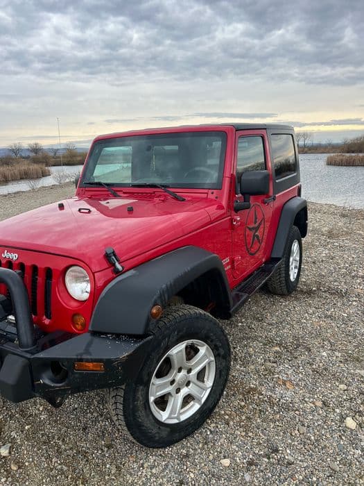 Vând Jeep Wrangler sport .