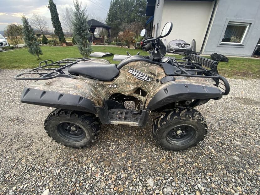 Zderzak grill lampa wahacz piasta zwrotnica połośka grizzly 700/550