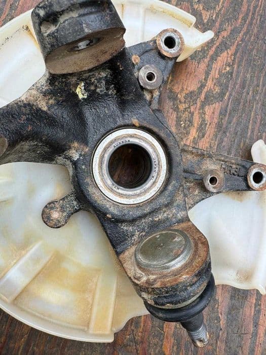 Honda TRX 420 / 500 / 520 Foreman zwrotnica lewa przod kola piasta OEM 2014-2024