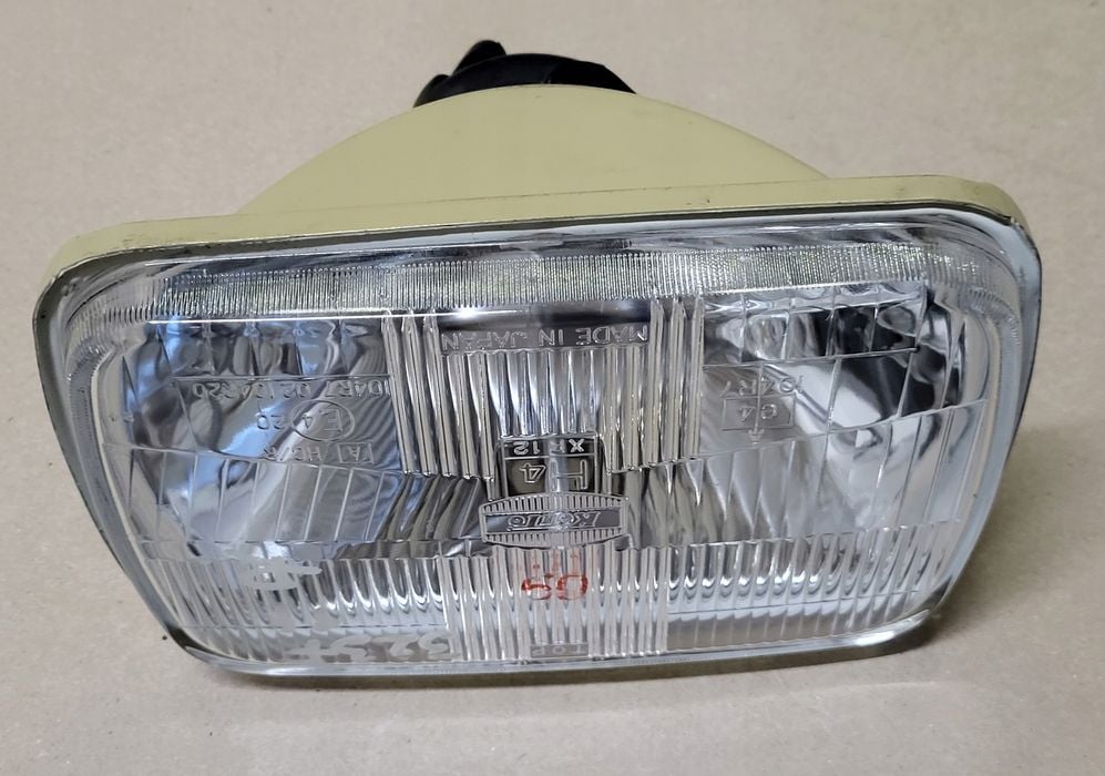 lampa przód reflektor h4 koito mazda jeep toyota hiace celica 4 runner nowa