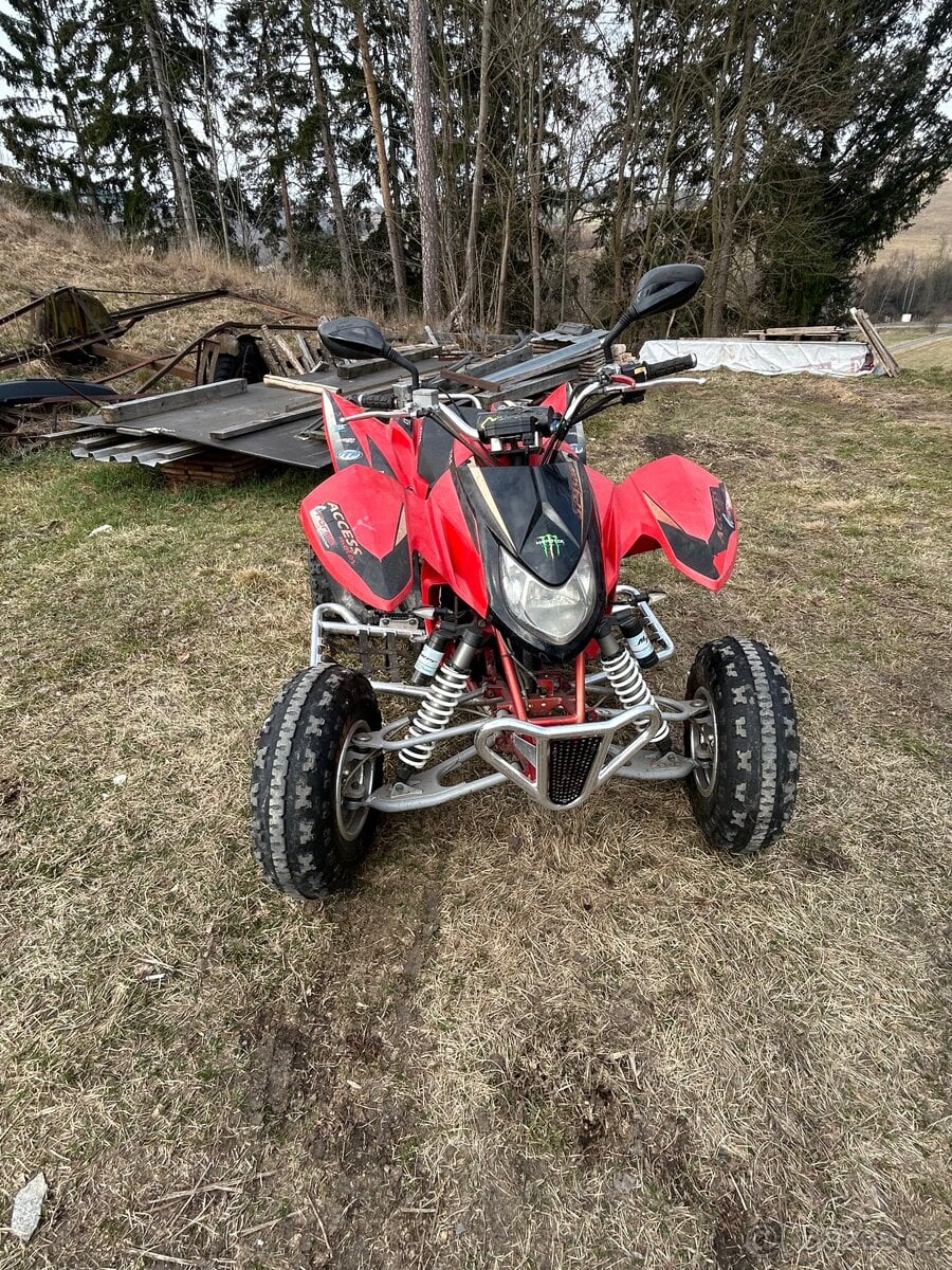 Prodám Access Warrior 450 + sada silničních pneu