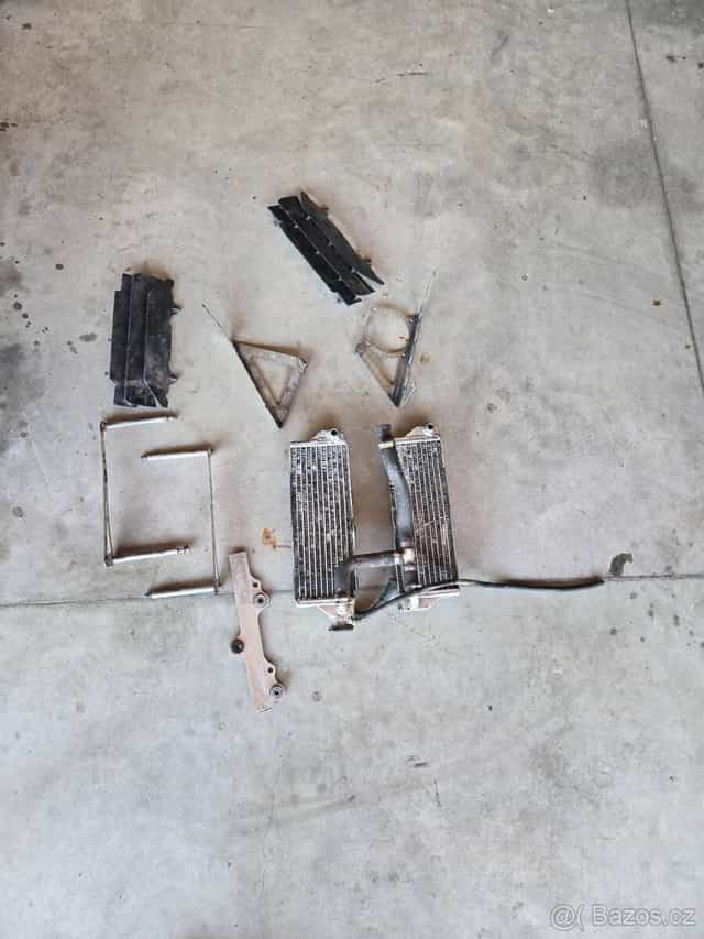 Chladiče,hadice a držáky Husqvarna 125